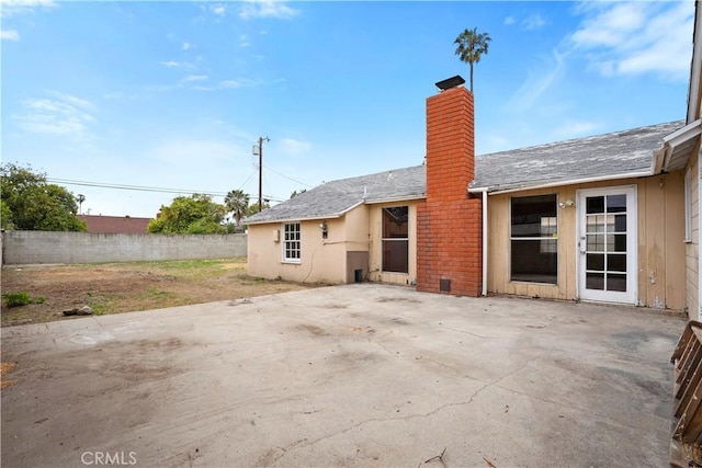6701 Matilija Ave, Van Nuys, CA 91405 - back of house with a chimney, a patio, and fence