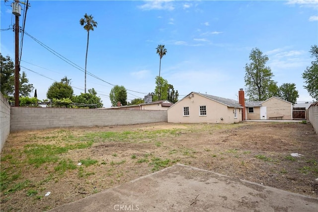 6701 Matilija Ave, Van Nuys, CA 91405 - fenced backyard with a patio