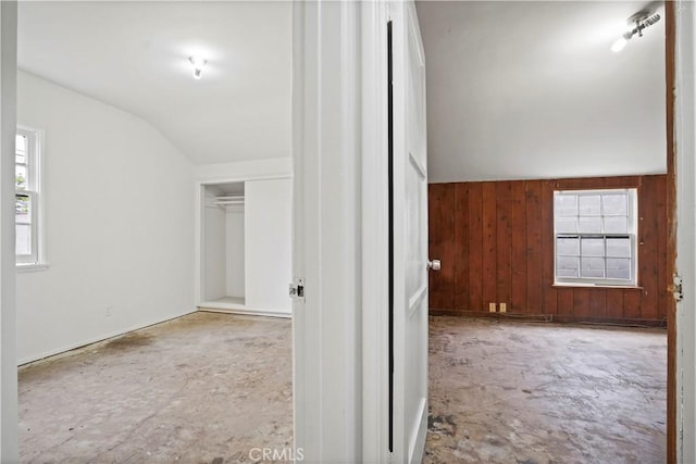 6701 Matilija Ave, Van Nuys, CA 91405 - corridor featuring vaulted ceiling, healthy amount of natural light, and wood walls