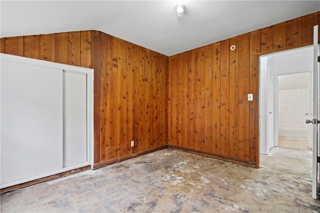 6701 Matilija Ave, Van Nuys, CA 91405 - spare room featuring lofted ceiling and wood walls