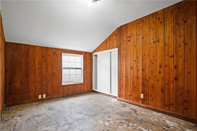 6701 Matilija Ave, Van Nuys, CA 91405 - spare room with lofted ceiling and wood walls
