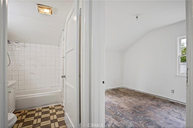 6701 Matilija Ave, Van Nuys, CA 91405 - bathroom featuring vaulted ceiling, toilet, vanity, and shower / washtub combination