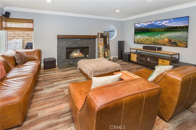 23015 Edenton Pl, Valencia, CA 91354 - living room featuring wood finished floors, a stone fireplace, recessed lighting, and crown molding