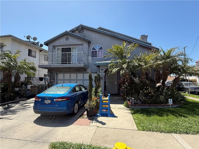 view of front facade with concrete driveway, an attached garage, a chimney, and stucco siding