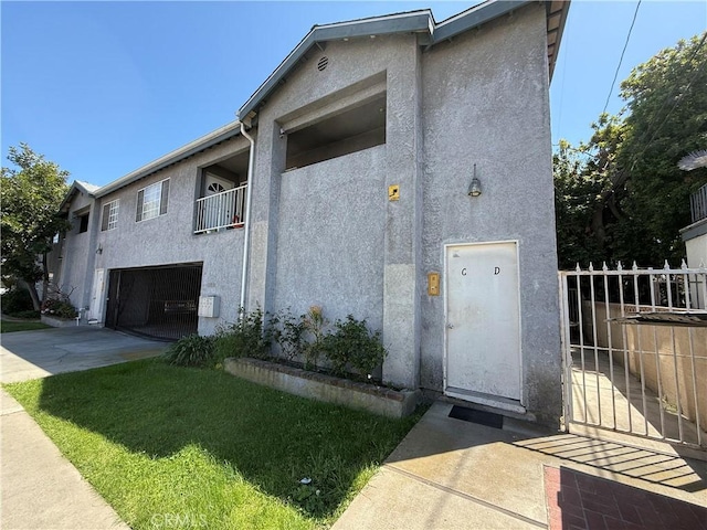 3702 W 126th St, Hawthorne, CA 90250 - view of front of property with driveway, stucco siding, an attached garage, and fence
