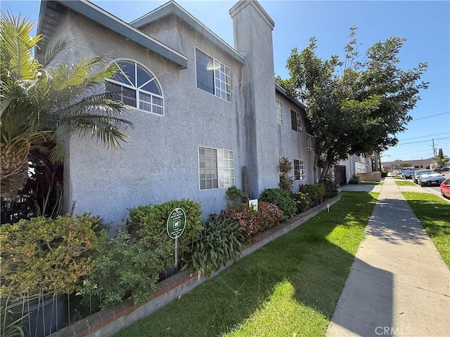 view of home's exterior with stucco siding