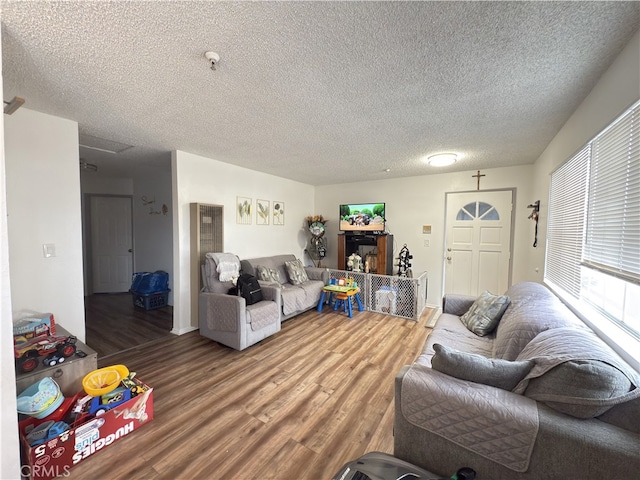 3702 W 126th St, Hawthorne, CA 90250 - living area with baseboards, a textured ceiling, and wood finished floors