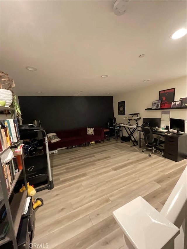 interior space with wood finished floors and recessed lighting