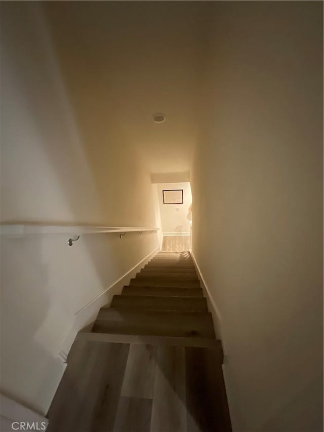 stairs with wood finished floors