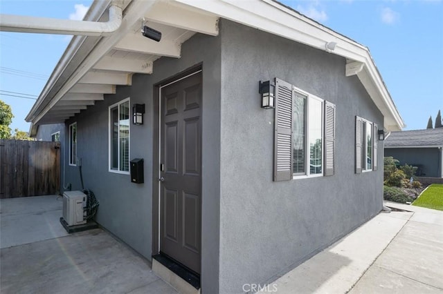 653 Joann St, Costa Mesa, CA 92627 - view of property exterior featuring fence, a patio area, and stucco siding
