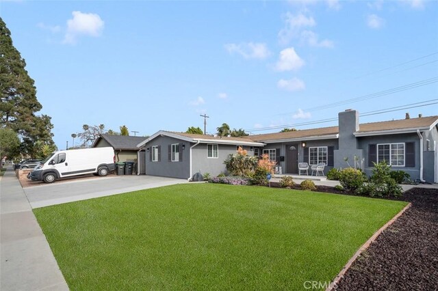 653 Joann St, Costa Mesa, CA 92627 - single story home with a chimney, stucco siding, and a front yard