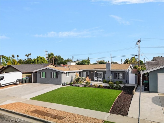 653 Joann St, Costa Mesa, CA 92627 - single story home with a gate, stucco siding, a front yard, and concrete driveway