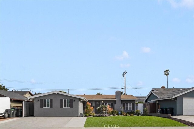 653 Joann St, Costa Mesa, CA 92627 - ranch-style house featuring a front lawn, stucco siding, fence, and concrete driveway