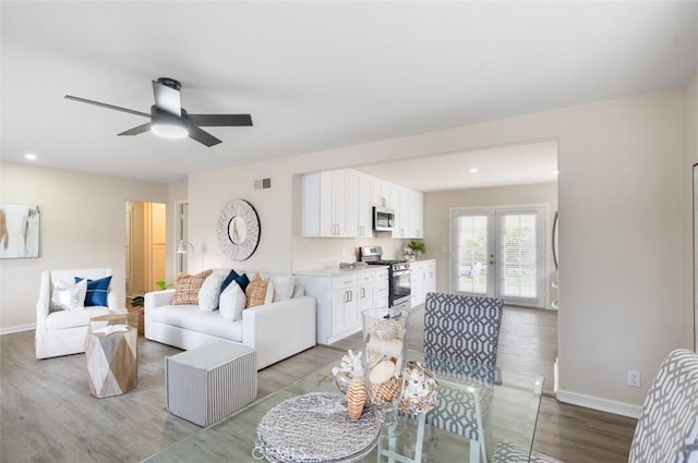 653 Joann St, Costa Mesa, CA 92627 - living area featuring french doors, a ceiling fan, light wood-style flooring, and baseboards