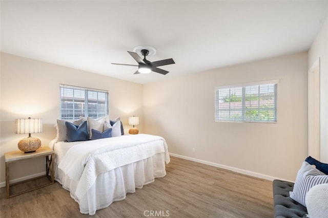 653 Joann St, Costa Mesa, CA 92627 - bedroom with baseboards, a ceiling fan, and wood finished floors