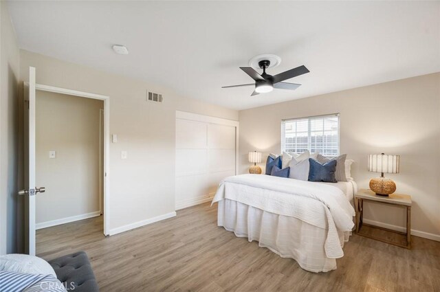 653 Joann St, Costa Mesa, CA 92627 - bedroom featuring baseboards, visible vents, wood finished floors, and a closet
