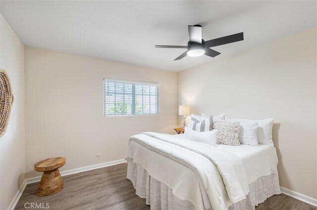653 Joann St, Costa Mesa, CA 92627 - bedroom with baseboards, ceiling fan, and wood finished floors