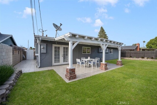 653 Joann St, Costa Mesa, CA 92627 - back of house with a patio area, french doors, stucco siding, a fenced backyard, and a lawn