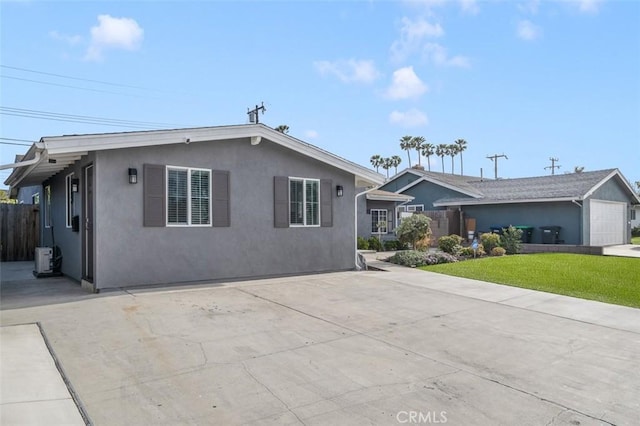 653 Joann St, Costa Mesa, CA 92627 - ranch-style house with stucco siding, concrete driveway, and a front lawn