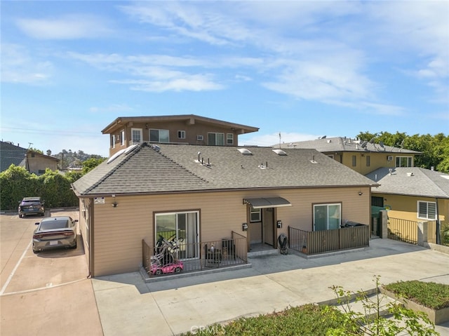 1344 E Broadway, Glendale, CA 91205 - back of property featuring fence and a shingled roof