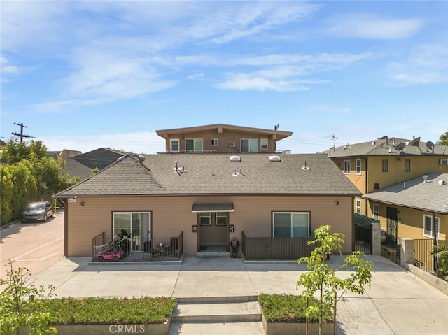 1344 E Broadway, Glendale, CA 91205 - back of property featuring fence and a shingled roof