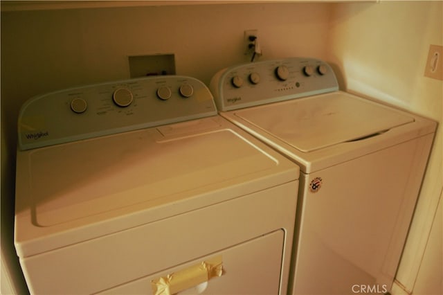 laundry room featuring independent washer and dryer and laundry area