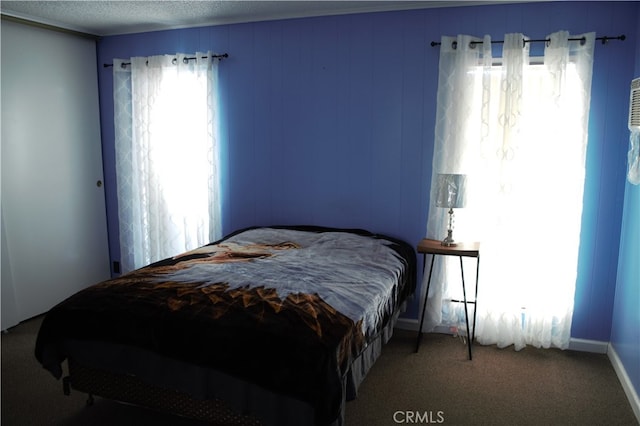 bedroom with carpet and baseboards