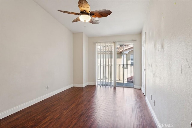 empty room with baseboards, wood finished floors, and ceiling fan
