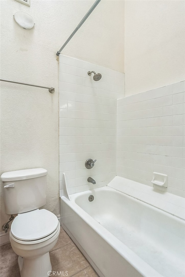 full bath featuring tile patterned floors, shower / bath combination, and toilet