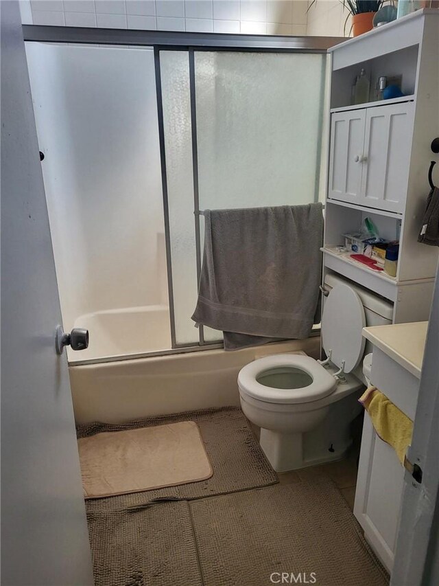 601 S Newhope St Unit 5, Santa Ana, CA 92704 - full bath featuring vanity, toilet, bath / shower combo with glass door, and tile patterned floors