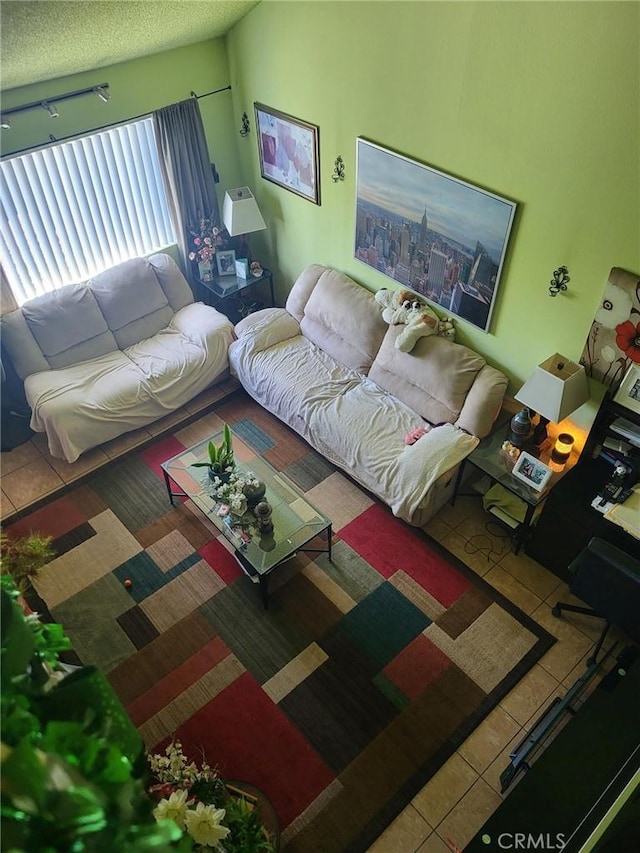 601 S Newhope St Unit 5, Santa Ana, CA 92704 - tiled living room with a textured ceiling