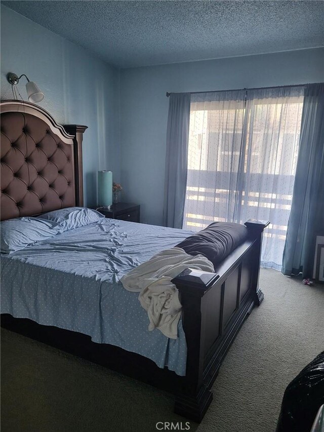 601 S Newhope St Unit 5, Santa Ana, CA 92704 - bedroom featuring a textured ceiling, carpet, and access to exterior