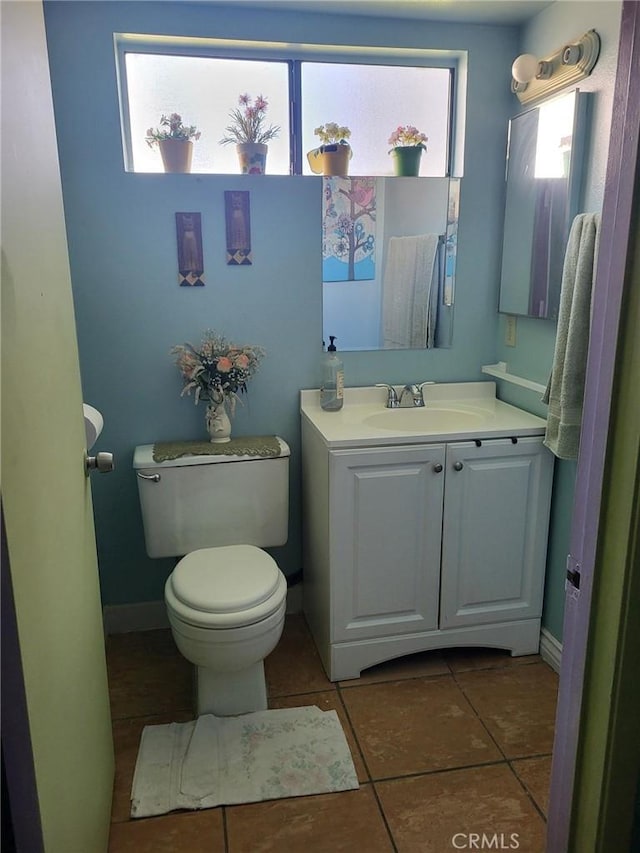 601 S Newhope St Unit 5, Santa Ana, CA 92704 - bathroom featuring vanity, toilet, tile patterned flooring, and plenty of natural light