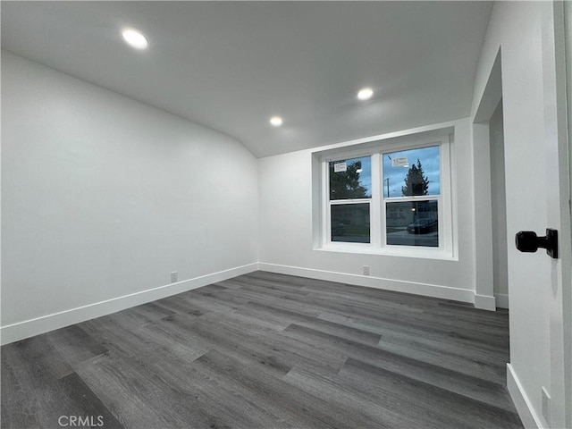 unfurnished room featuring recessed lighting, baseboards, and dark wood-type flooring