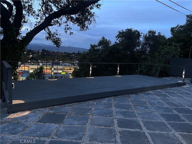 view of patio with a deck with mountain view