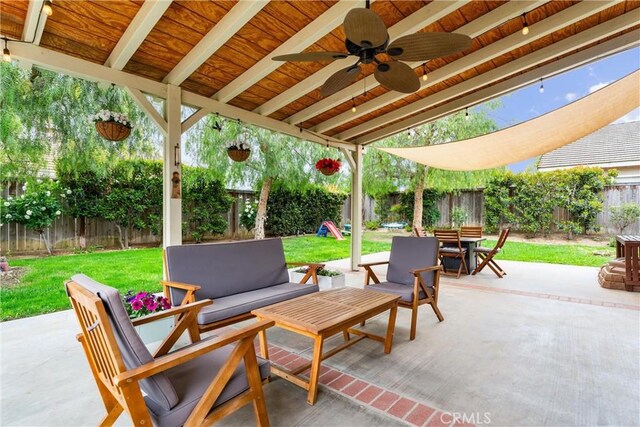 view of patio featuring ceiling fan, a fenced backyard, outdoor lounge area, and outdoor dining space