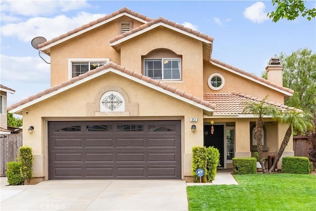 view of front of home with a garage, driveway, a front yard, and a tile roof