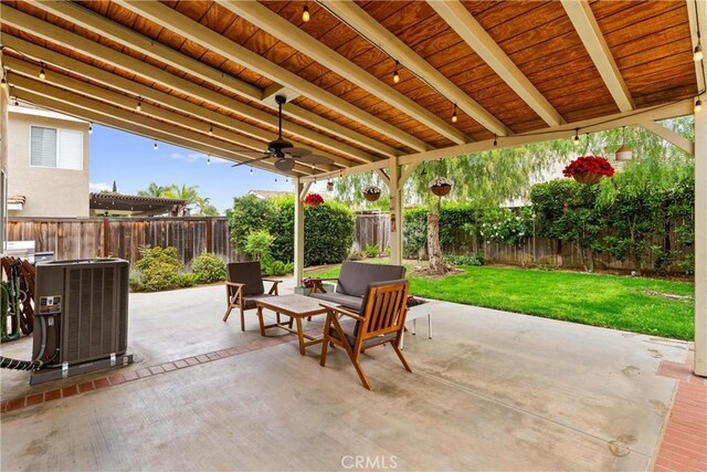 view of patio / terrace featuring a fenced backyard, a ceiling fan, and central AC