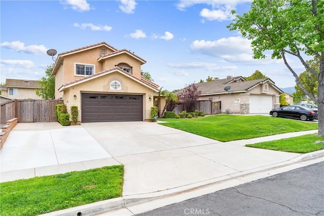 view of front of house with fence, concrete driveway, stucco siding, a front yard, and a garage