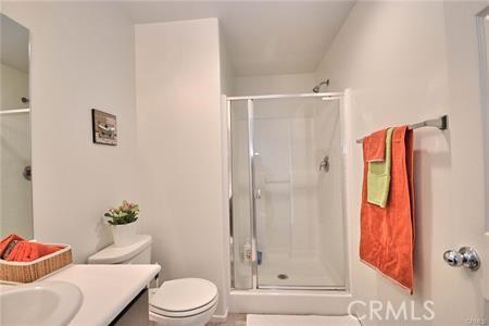 5374 Mission Rock Way, Jurupa Valley, CA 92509 - full bathroom with toilet, vanity, and a stall shower