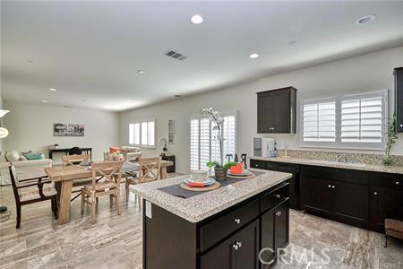 5374 Mission Rock Way, Jurupa Valley, CA 92509 - kitchen featuring open floor plan, light countertops, visible vents, and recessed lighting