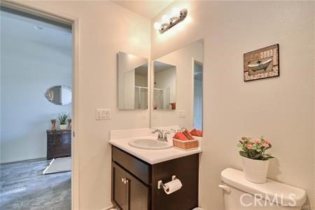 5374 Mission Rock Way, Jurupa Valley, CA 92509 - bathroom featuring toilet and vanity