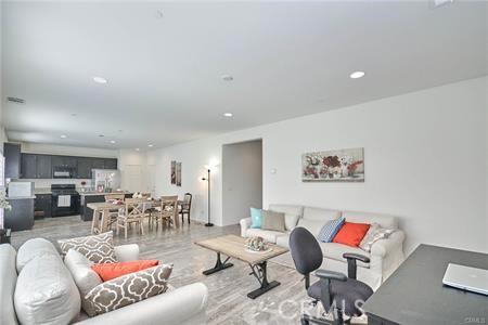 5374 Mission Rock Way, Jurupa Valley, CA 92509 - living room featuring light wood-style floors and recessed lighting