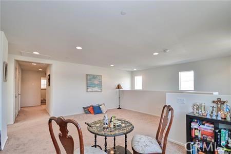 5374 Mission Rock Way, Jurupa Valley, CA 92509 - dining room with recessed lighting, light colored carpet, and a healthy amount of sunlight