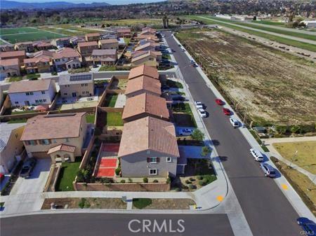 5374 Mission Rock Way, Jurupa Valley, CA 92509 - aerial view featuring a mountain view and a residential view