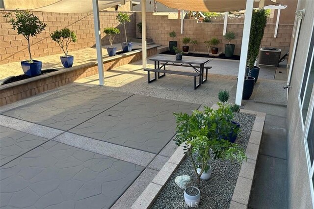 5374 Mission Rock Way, Jurupa Valley, CA 92509 - view of patio / terrace featuring a fenced backyard and central AC unit