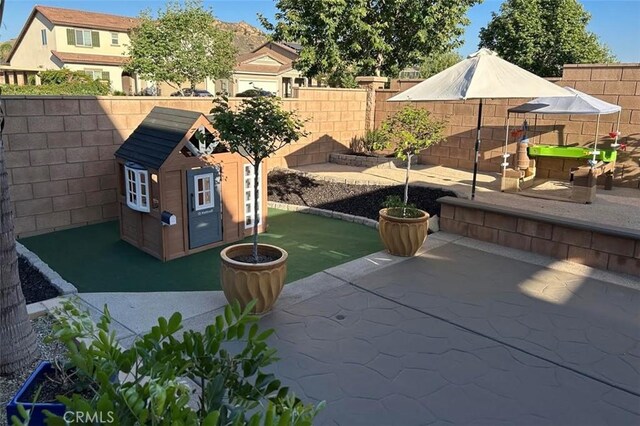 5374 Mission Rock Way, Jurupa Valley, CA 92509 - view of patio / terrace with a fenced backyard