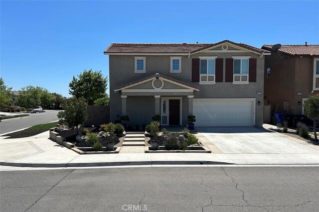 5374 Mission Rock Way, Jurupa Valley, CA 92509 - traditional home with an attached garage, stucco siding, and concrete driveway