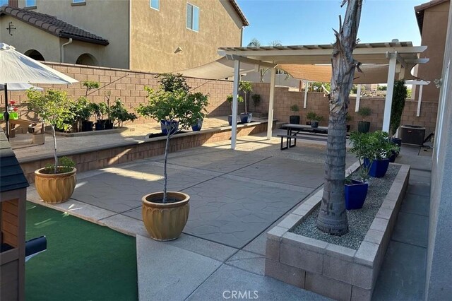 5374 Mission Rock Way, Jurupa Valley, CA 92509 - view of patio / terrace featuring a fenced backyard, a pergola, and central AC