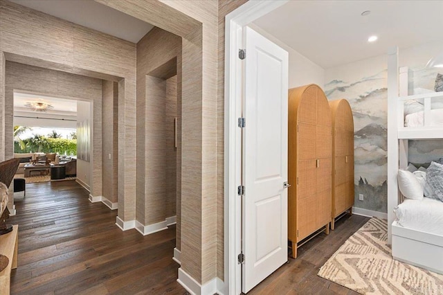 corridor with dark wood-style floors and recessed lighting